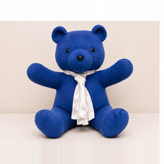 Blue fleece memory bear with a white satin scarf