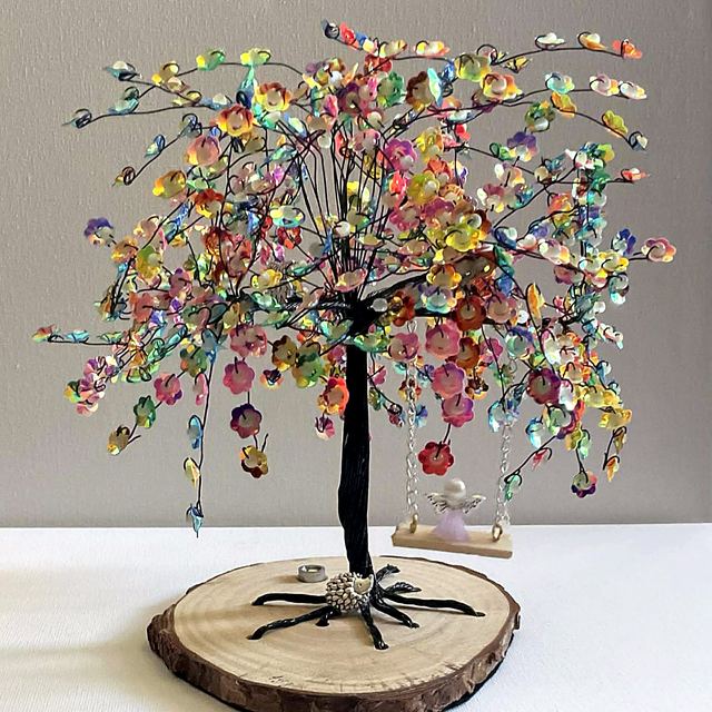 Memory tree with black wire and bright multicoloured blossoms