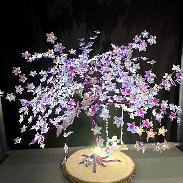 Lilac memory tree lit up with warm lights