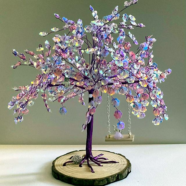 Memory tree with purple wire and iridescent pink blossoms