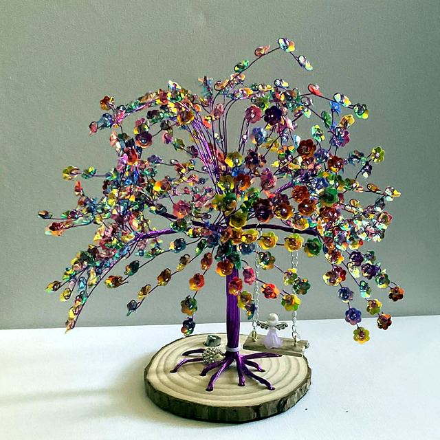 Memory tree with purple wire and bright multicoloured blossoms