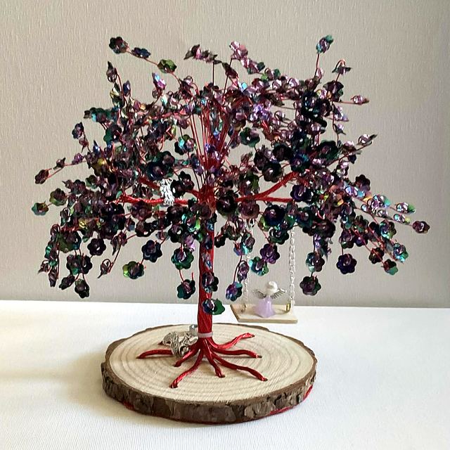 Memory tree with red wire and deep plum and teal blossoms